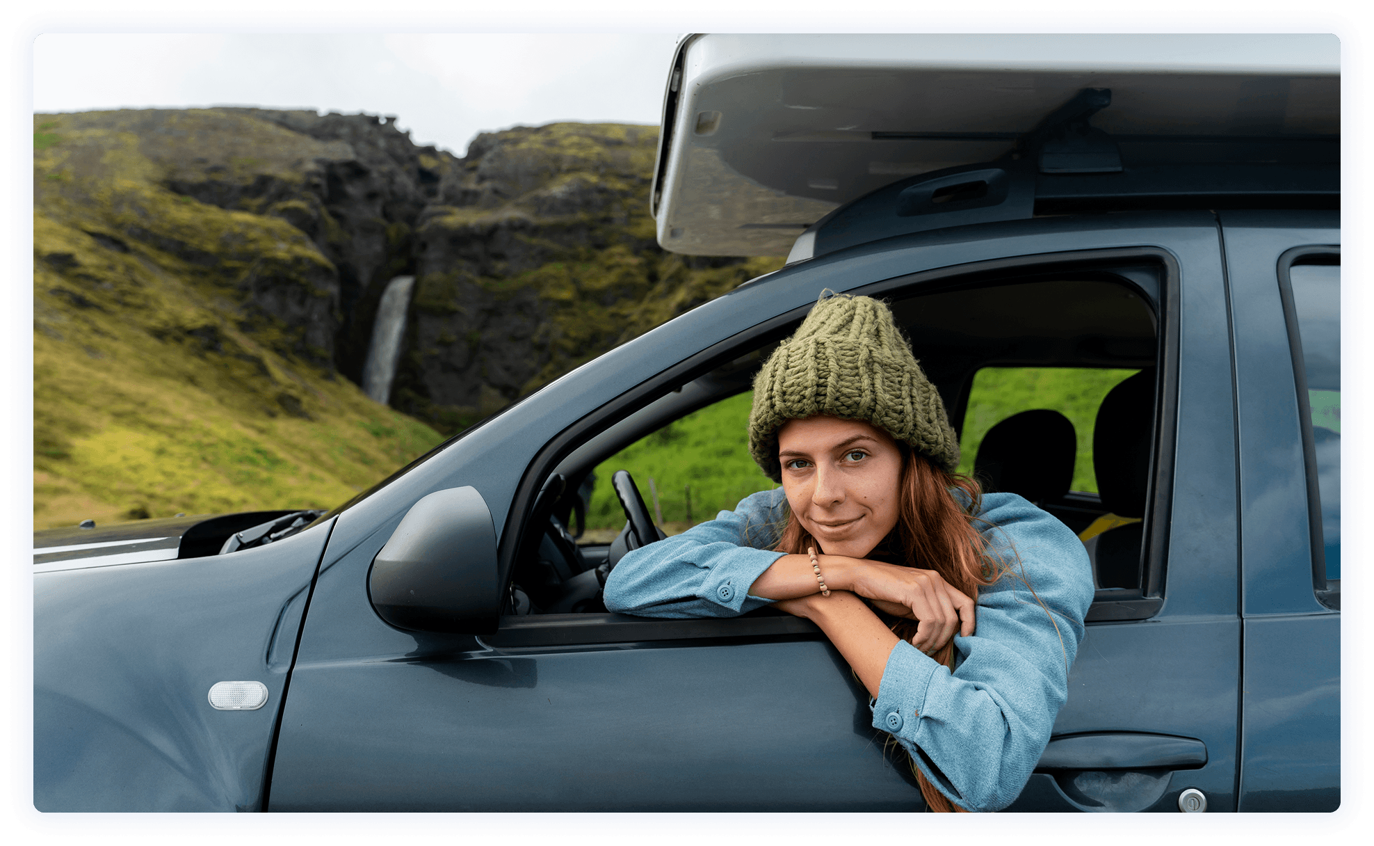 Happy girl traveler looking out window
